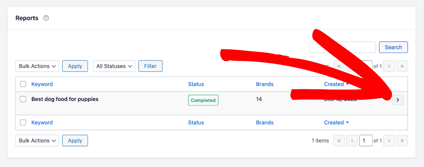 Arrow button shown to the right of report row in the Reports table
